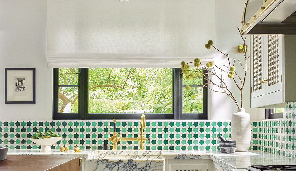 Roman Shades for kitchen windows made of Tangier Weave in Blanco add texture to a kitchen with Mediterranean tiles