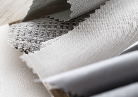 Swatches in cool tones and various textures from the in-stock collection are ideal for cool neutral curtains