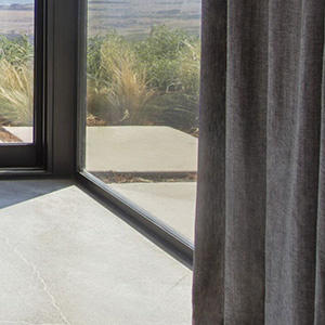 Blackout lining on drapery blocks up to 99% of the light for a room darkening effect ideal for bedroom window treatment ideas