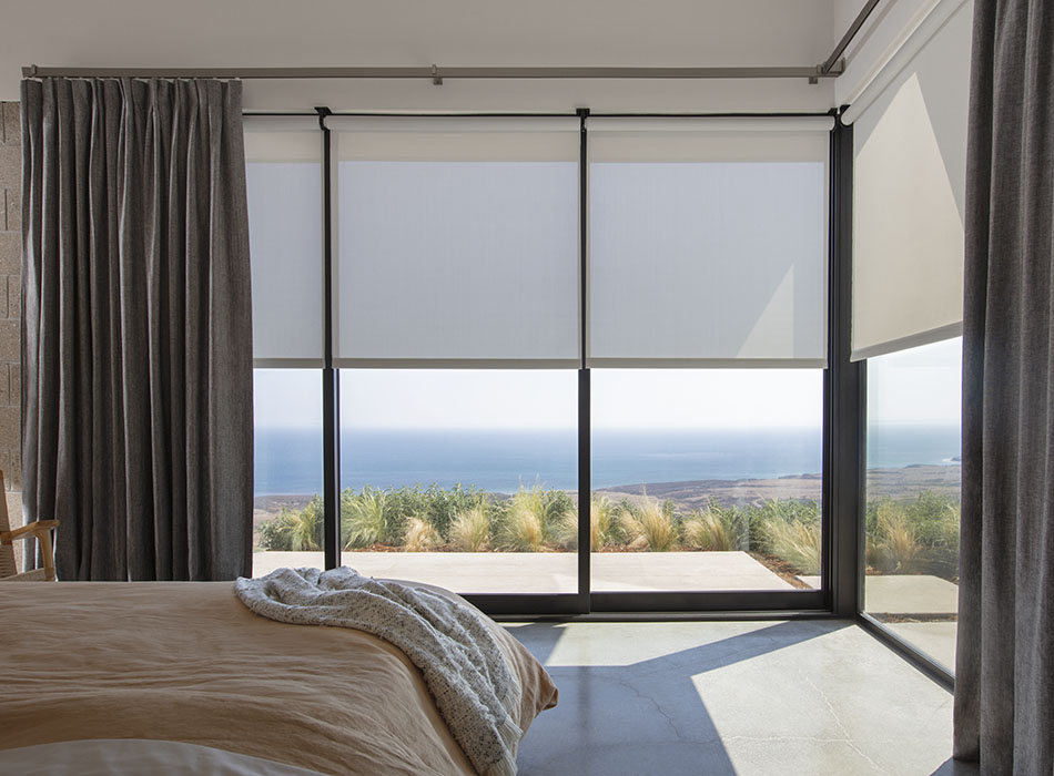 Sliding glass door curtain ideas include Inverted Pleat Drapery made of thick cotton-linen blend, Herringbone in Onyx