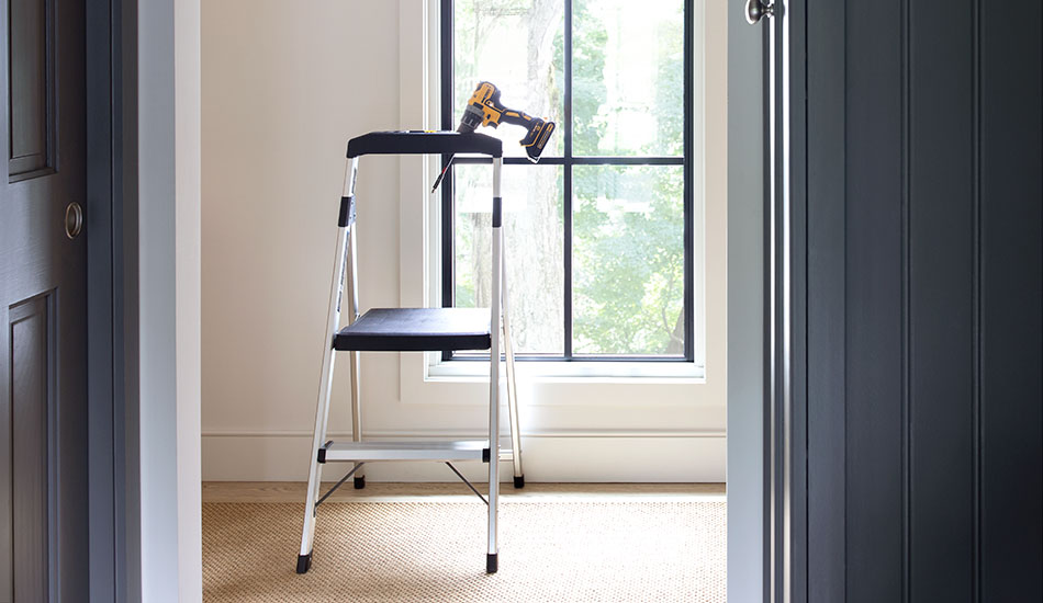 Between Solar Shades vs Roller Shades, both have the same installation process, requiring a drill and stepladder as shown