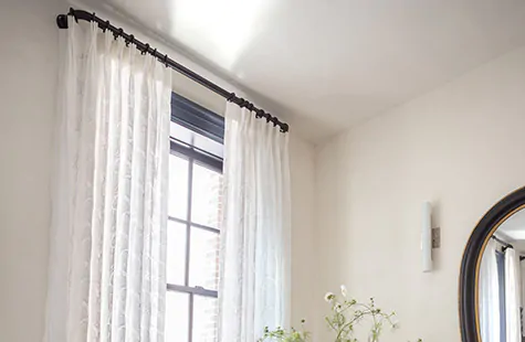 French return curtain rods like Lafayette in Matte Black offer easy use for Pinch Pleat Drapery in Feather Palm Embroidery