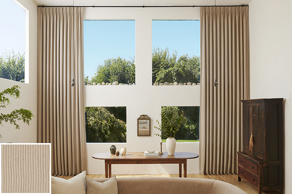 Colorful curtains made of Surrey Stripe in Morel and Natural add a warm earthy backdrop to a living room with rich wood tones