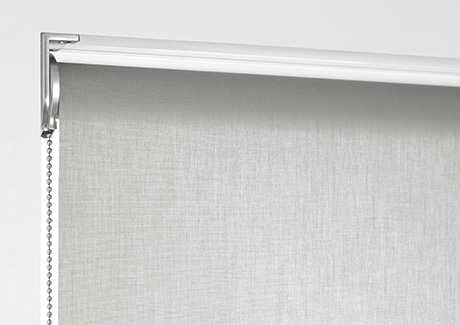 A product image of Roller Shades for windows shows a reverse roll where the material falls off the front of the tube