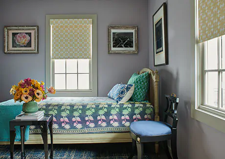 To compare light filtering vs blackout a colorful bedroom has blackout Roller Shades made of Porringer in Mimosa