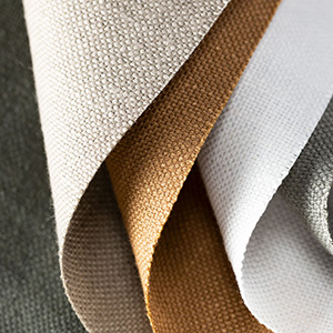 Swatches of Nate Berkus' Lisbon Woven showcase the rich colors and offer warmth and texture to linen Roman Shades