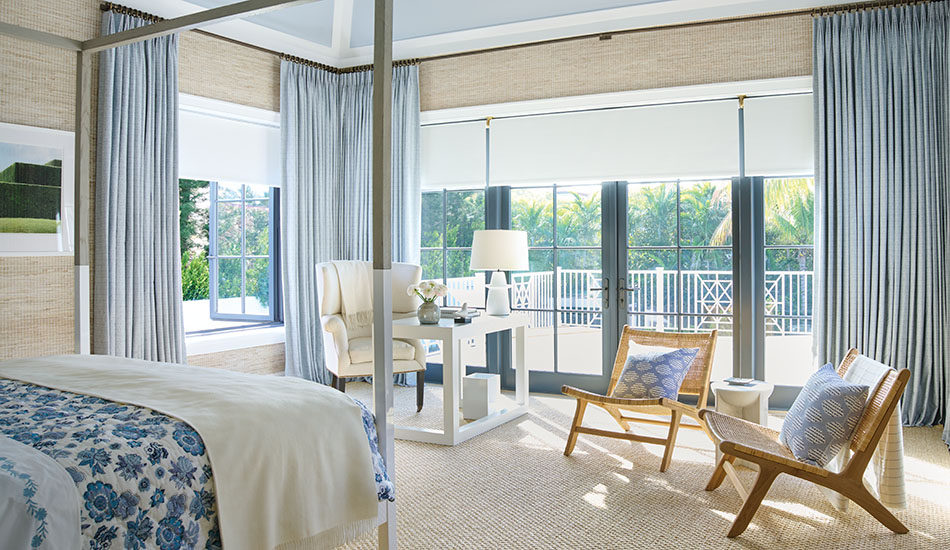 A coastal bedroom has curtains to keep heat out made of Tailored Pleat Drapery in Vanda, Sky with lining