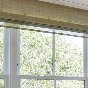 Waterfall Woven Wood Shades made of Laguna in Tan have no lining, so light filters through the natural fibers beautifully